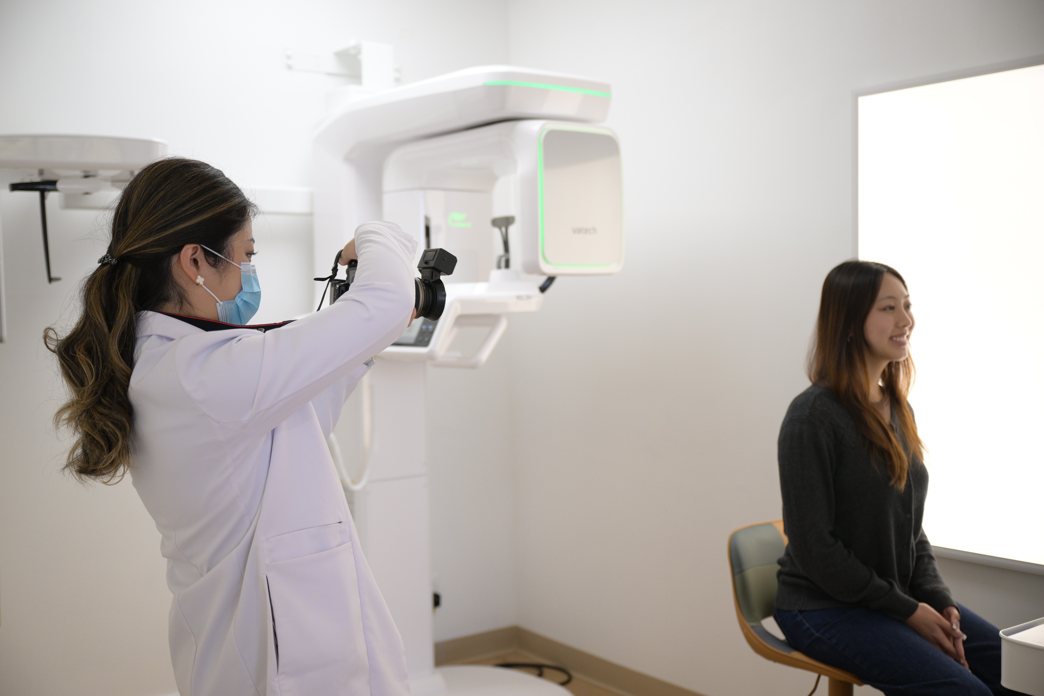 dr. huang take photos for a patient at aicare orthodontics