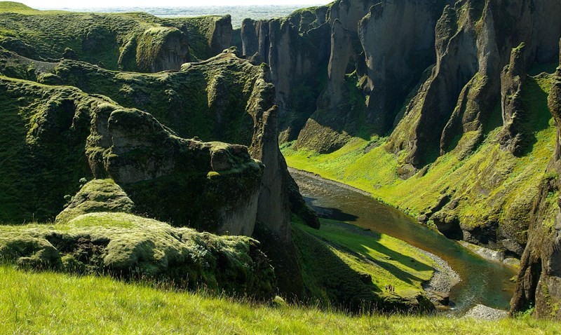 Lush green river canyon Fjaðrárgljúfur Iceland