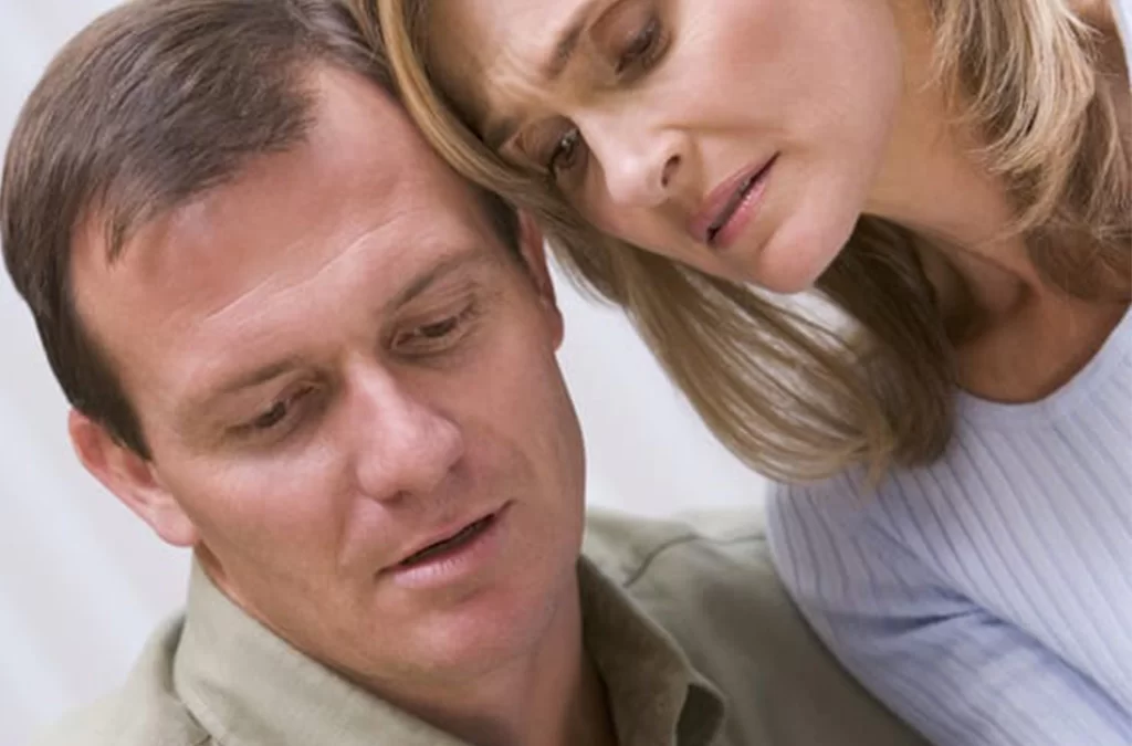 Couple looking at fertility test