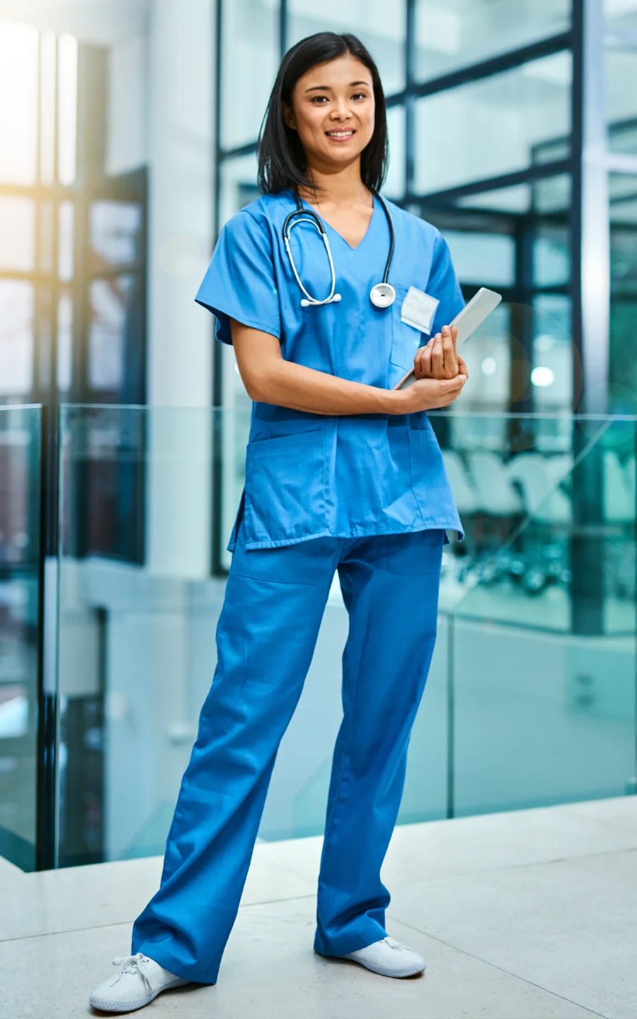 Doctor and Filipino nurse reviewing chart.