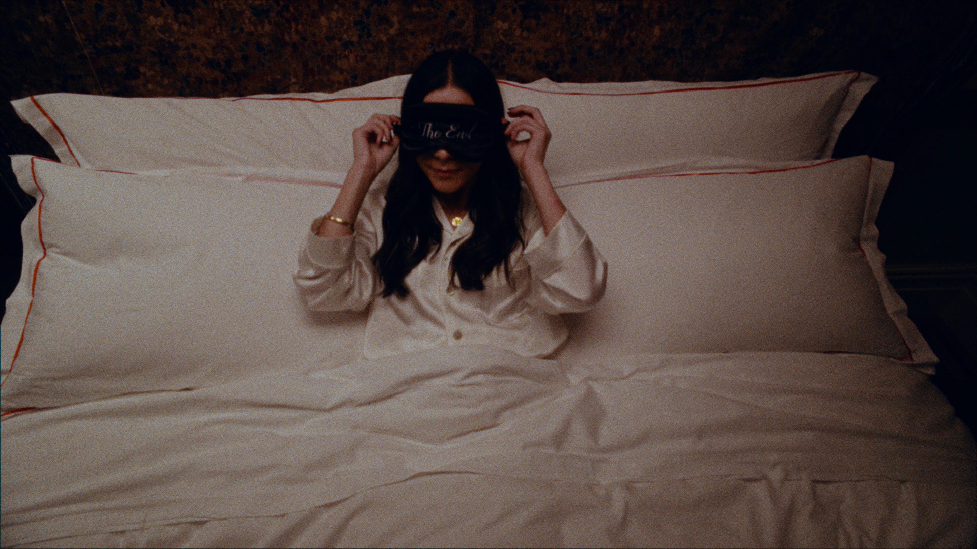 Woman goes to sleep in the lavish Chelsea Hotel using a "the end' eyemask