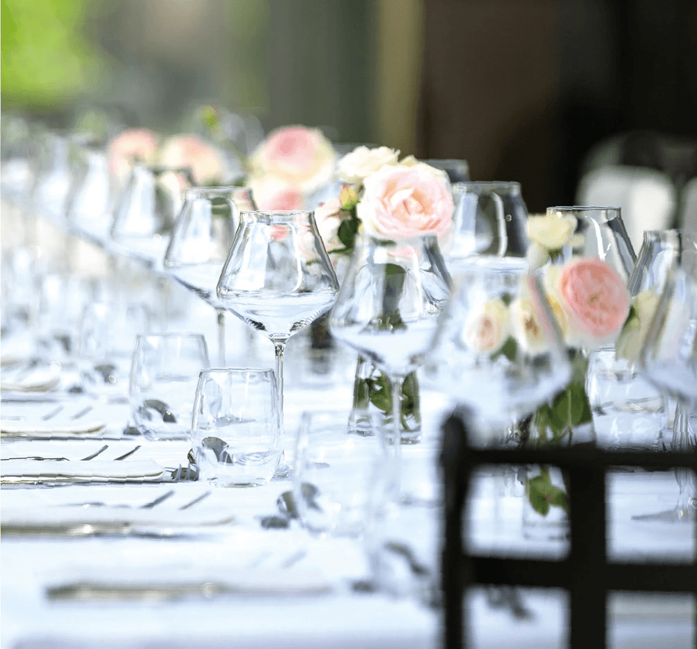 an interior of a fine dining restaurant with focused shot on the table with the plates and glass has been served