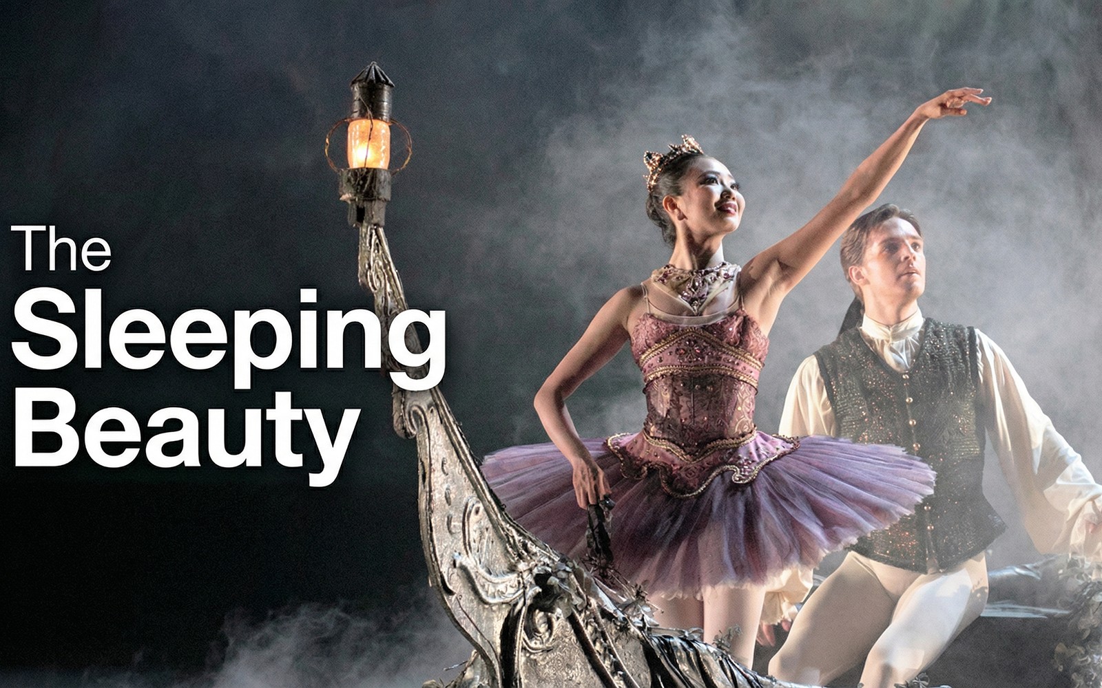 Ballet dancers performing "The Sleeping Beauty" on stage with ornate set design.