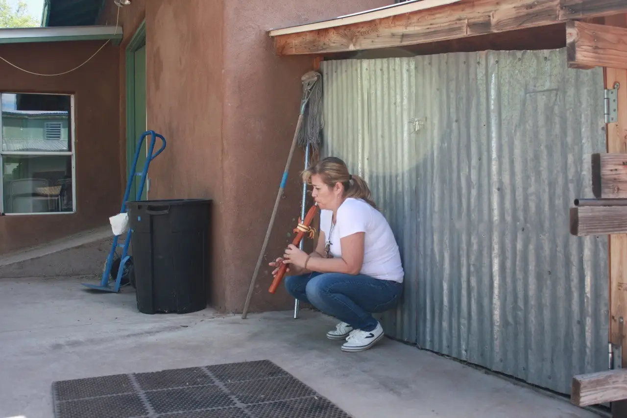 Person tuning a flute