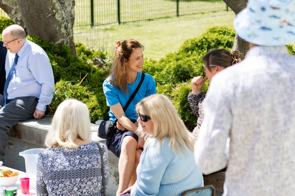 a group of people sitting around a table