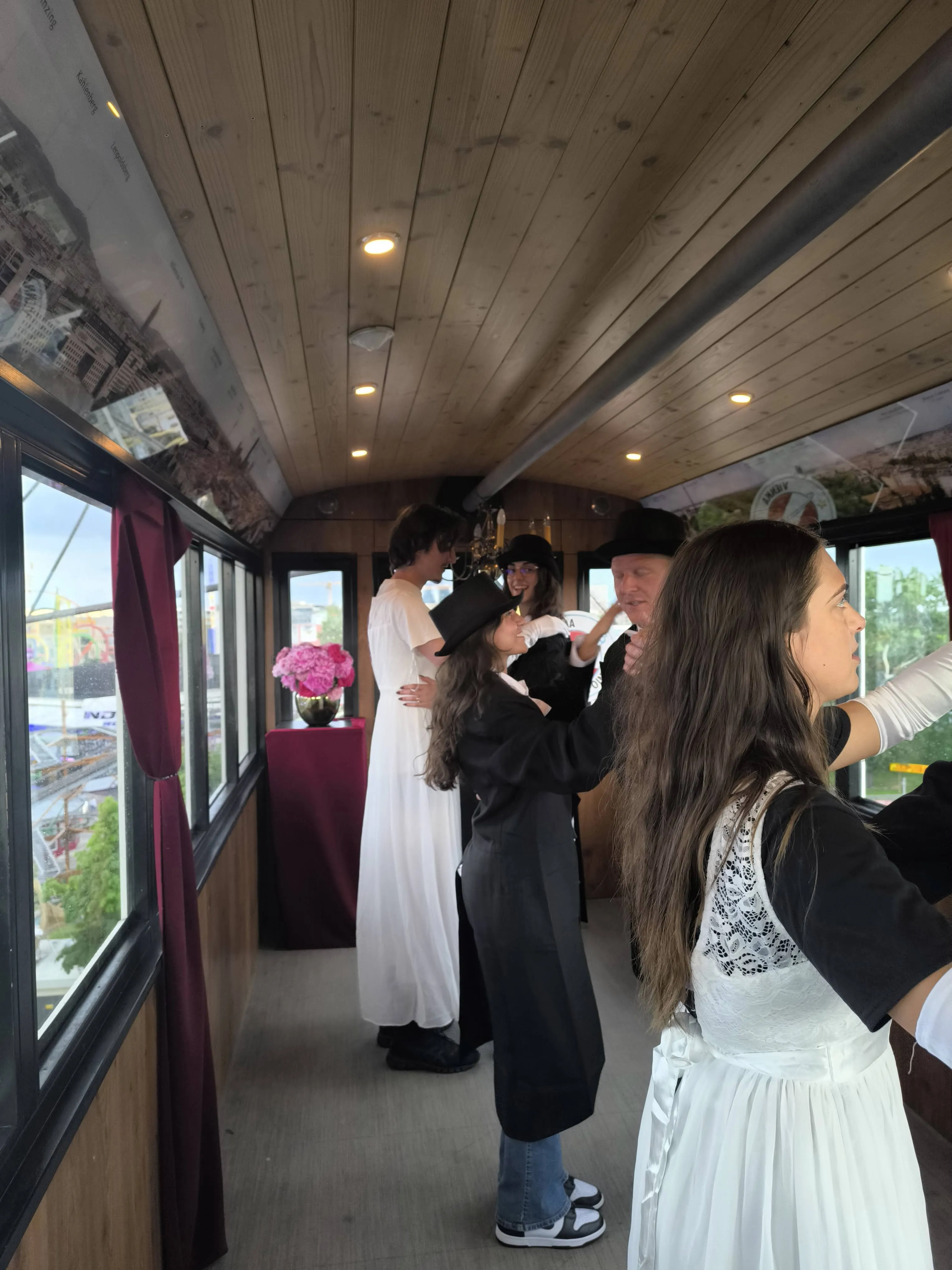 Big wheel gondola in Vienna with people dancing the waltz