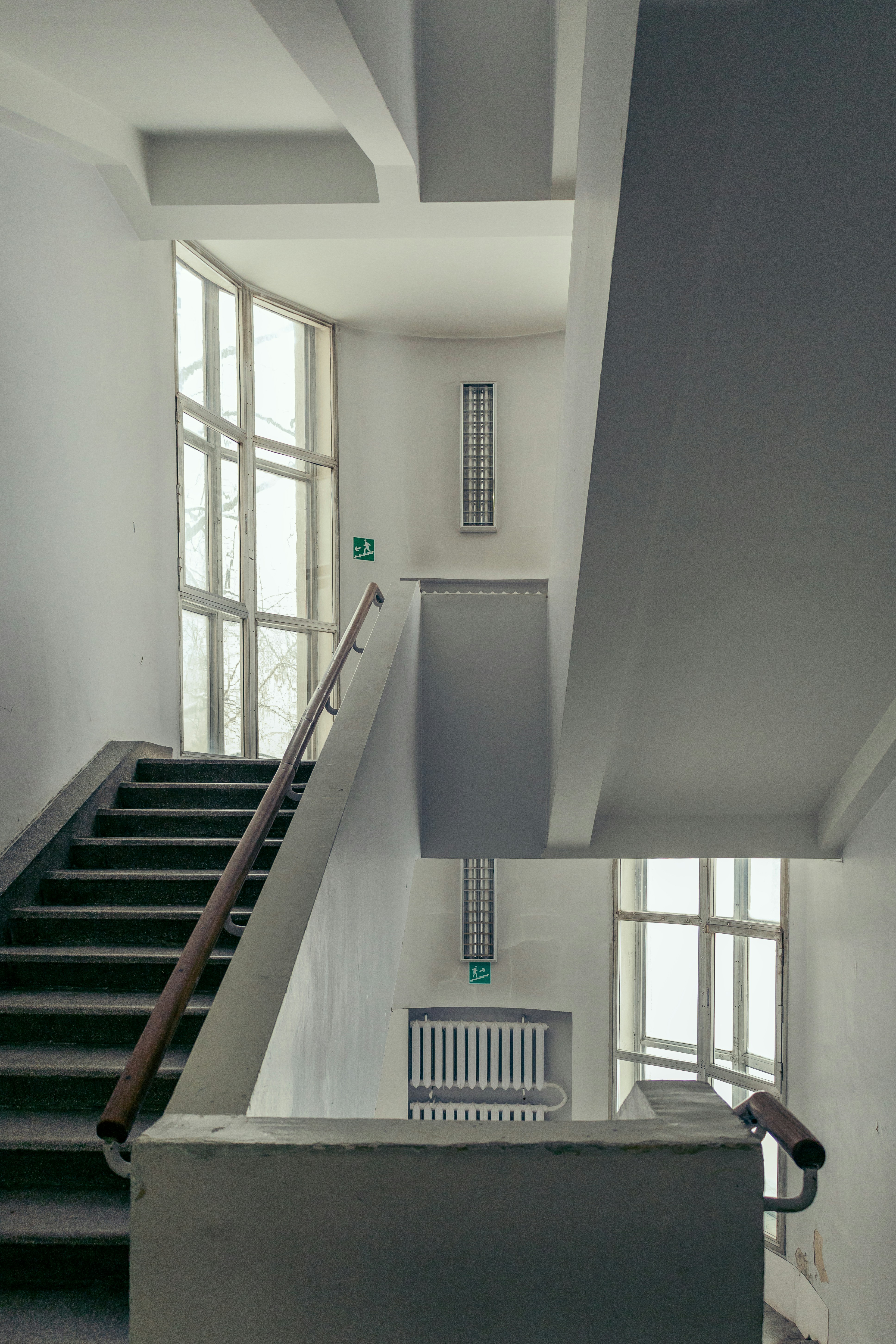 a staircase leading up to a window in a building