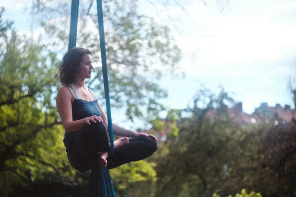 Floating mindfulness meditation and restorative aerial yoga technique for online certification