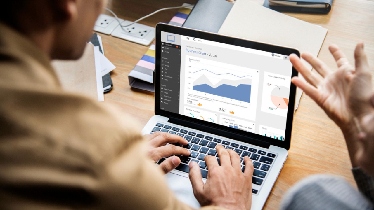 People working on a laptop in a meeting