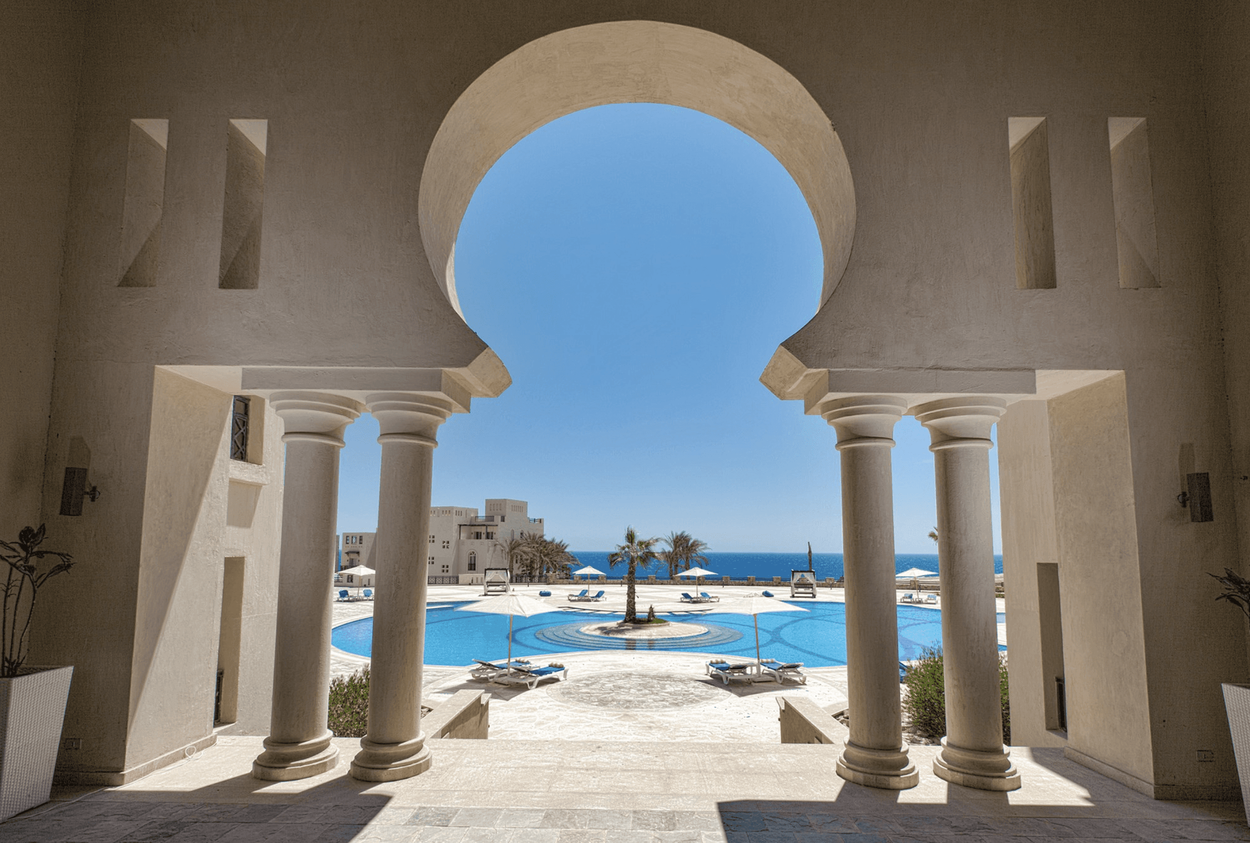 brown wooden house with green grass field