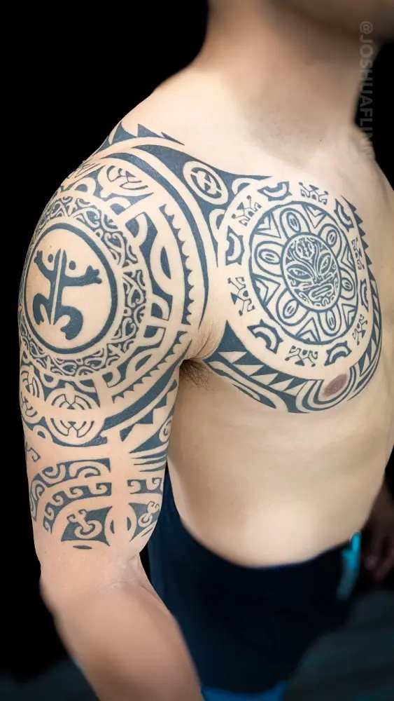 polynesian chest and shoulder tattoo