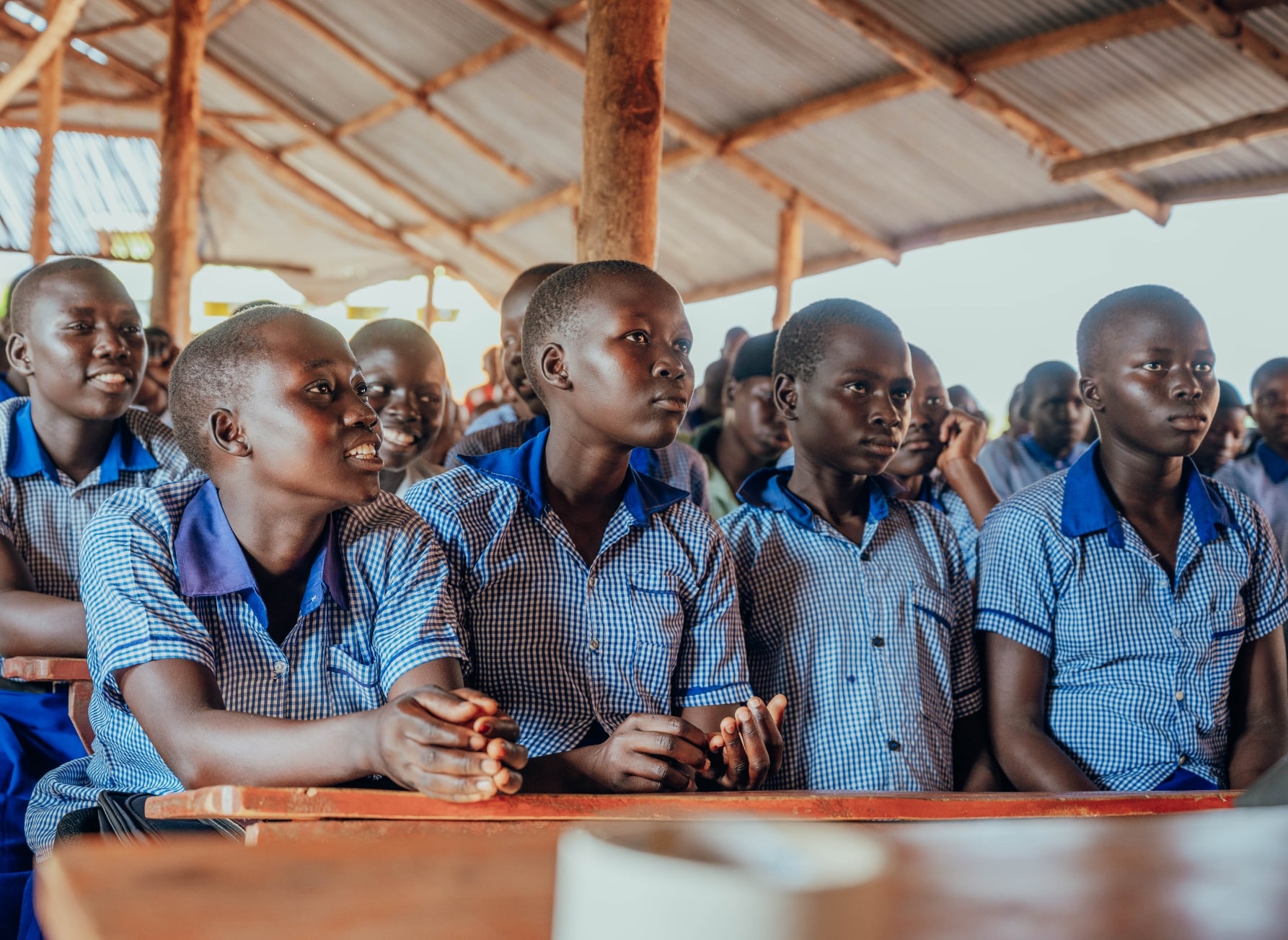 Students in a classroom receiving education about menstruation.