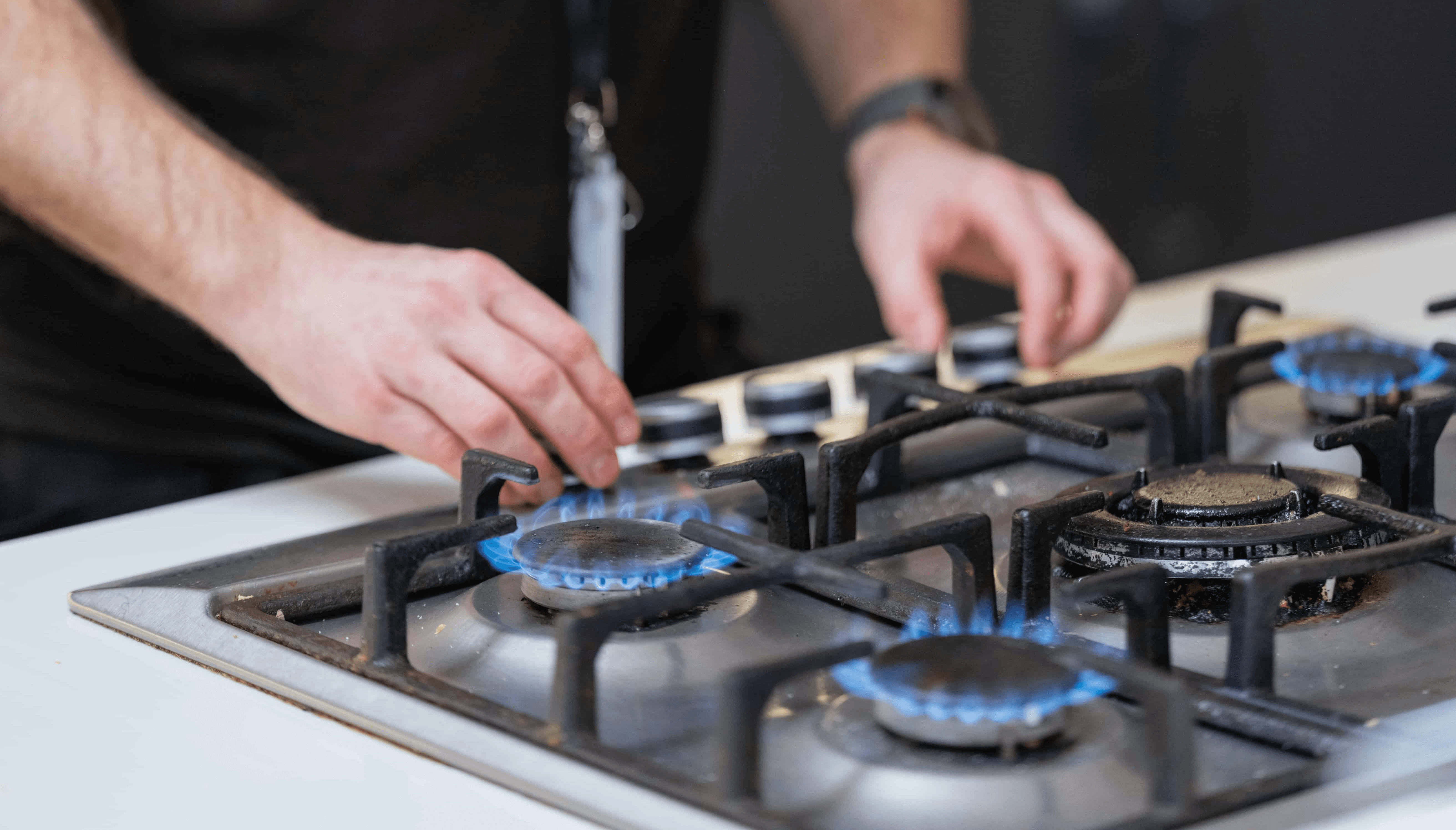 Gas safe registered heating engineer carrying out a gas safety check in north london