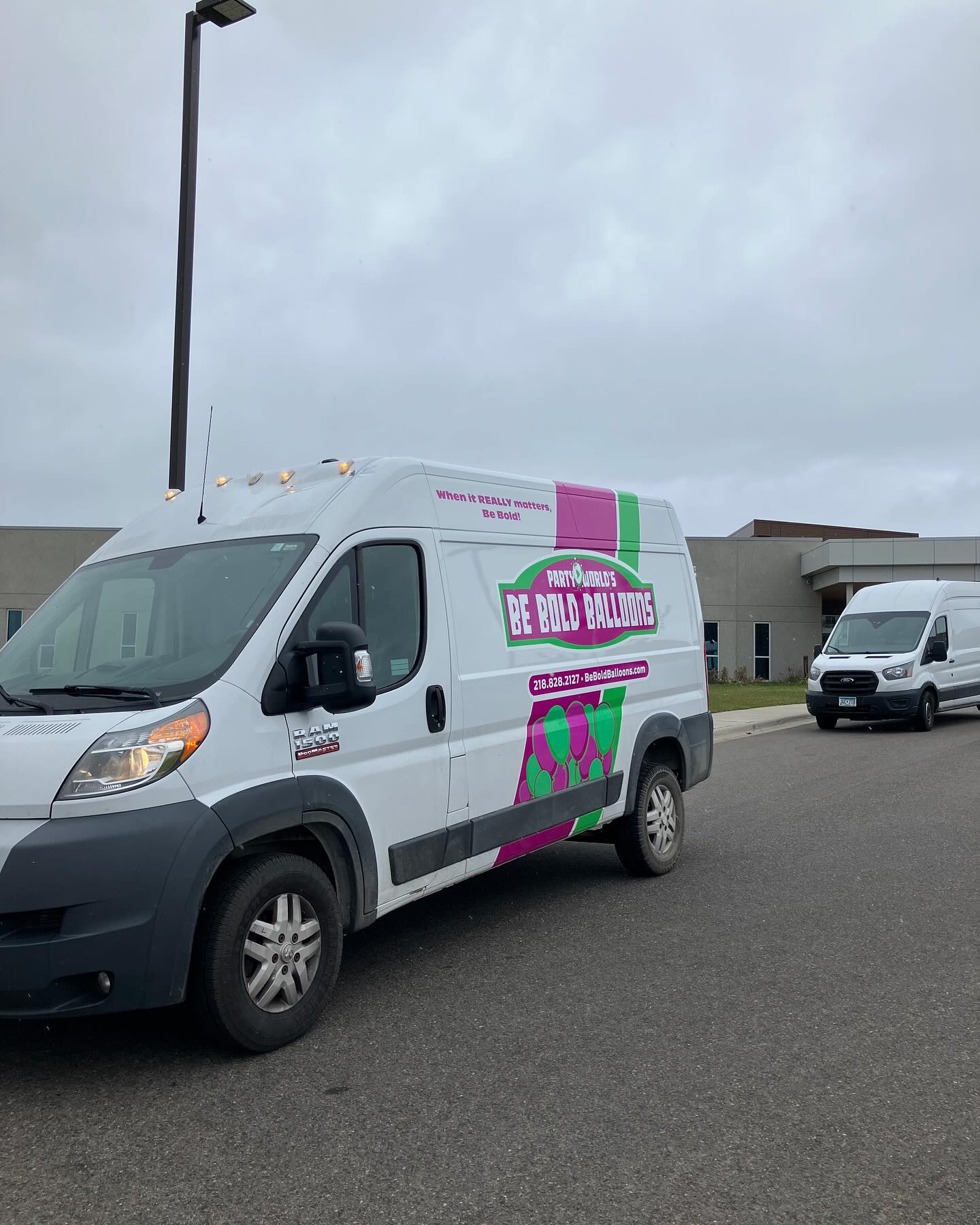 Be Bold Balloons delivery van with company logo parked outside a building ready for event setup