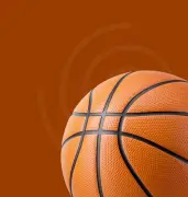Orange basketball on brown background