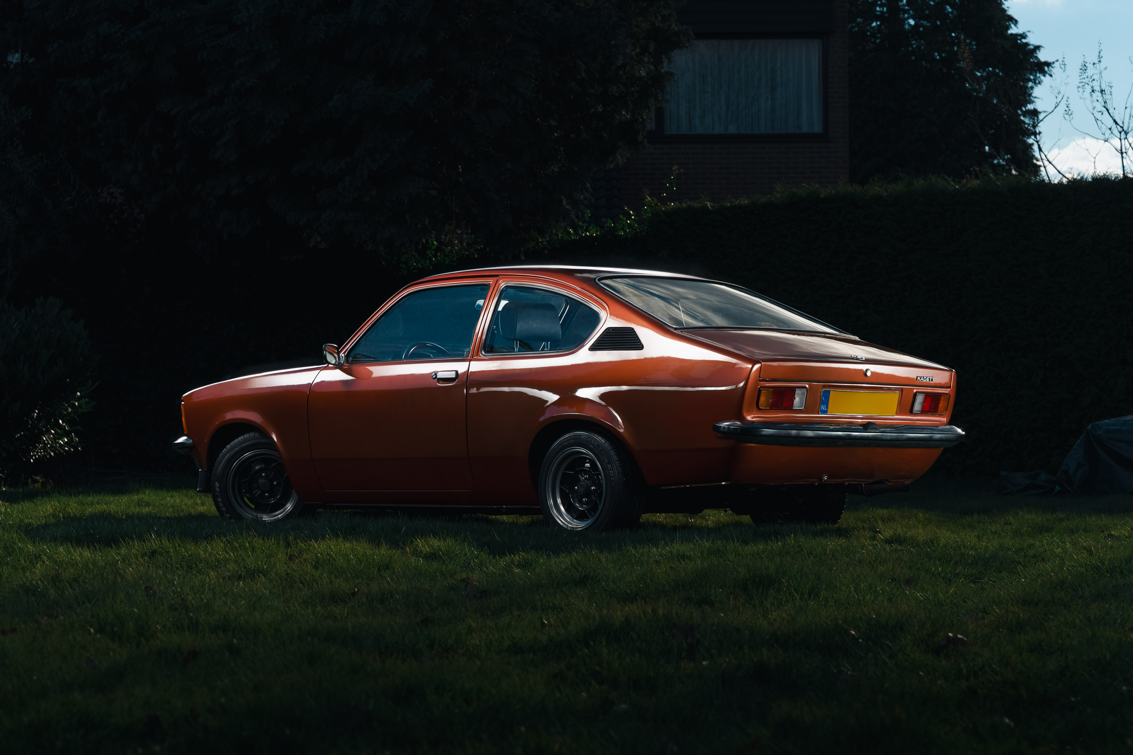 Ford Escort MK1 Rally car with rally modifications, displayed in a studio setting, showcasing its classic design and racing features.