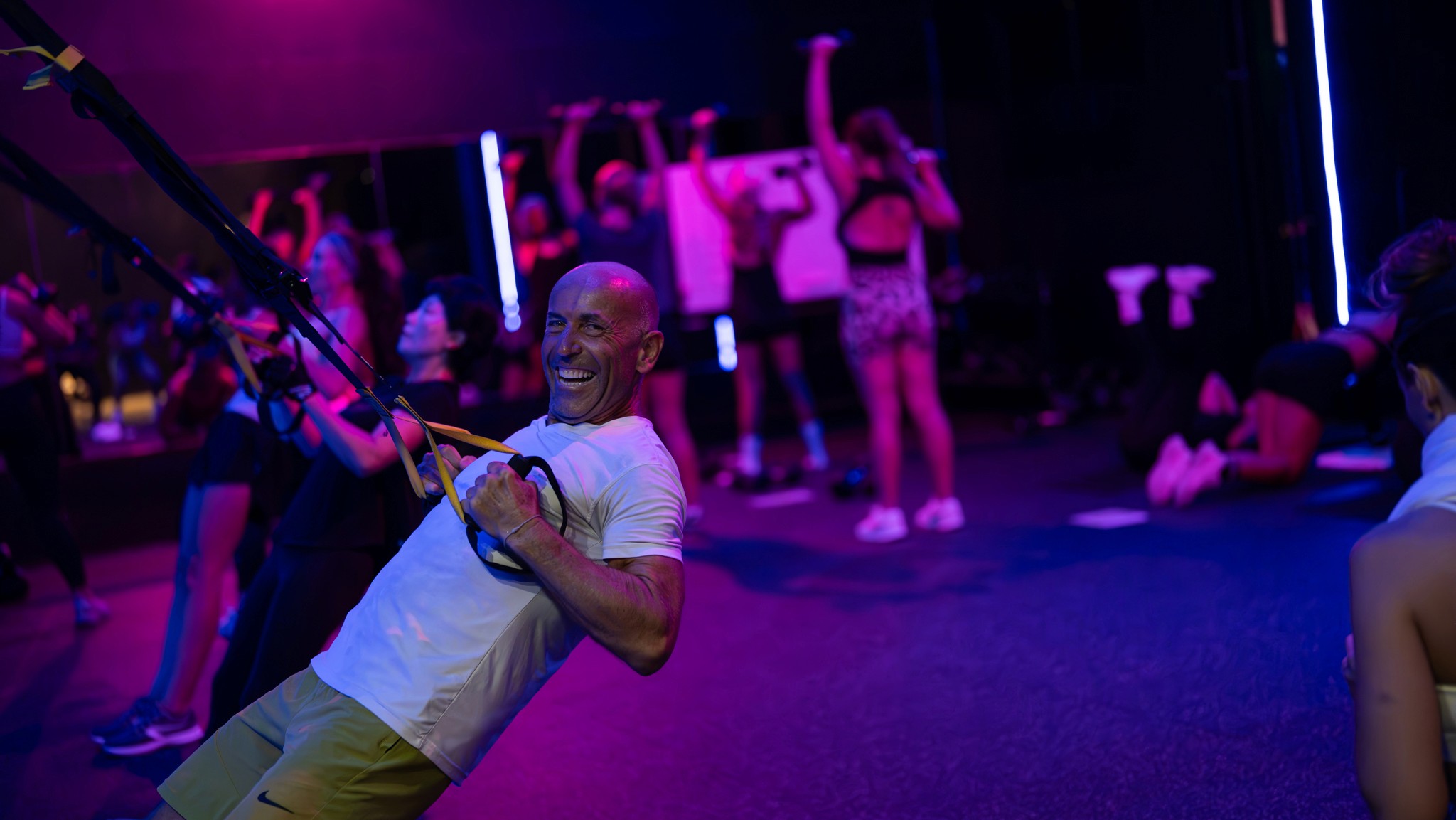 Energetic BODYCOMBAT group class at Legacy Muscle Universe Koh Samui, led by expert instructors in a high-energy fitness studio.