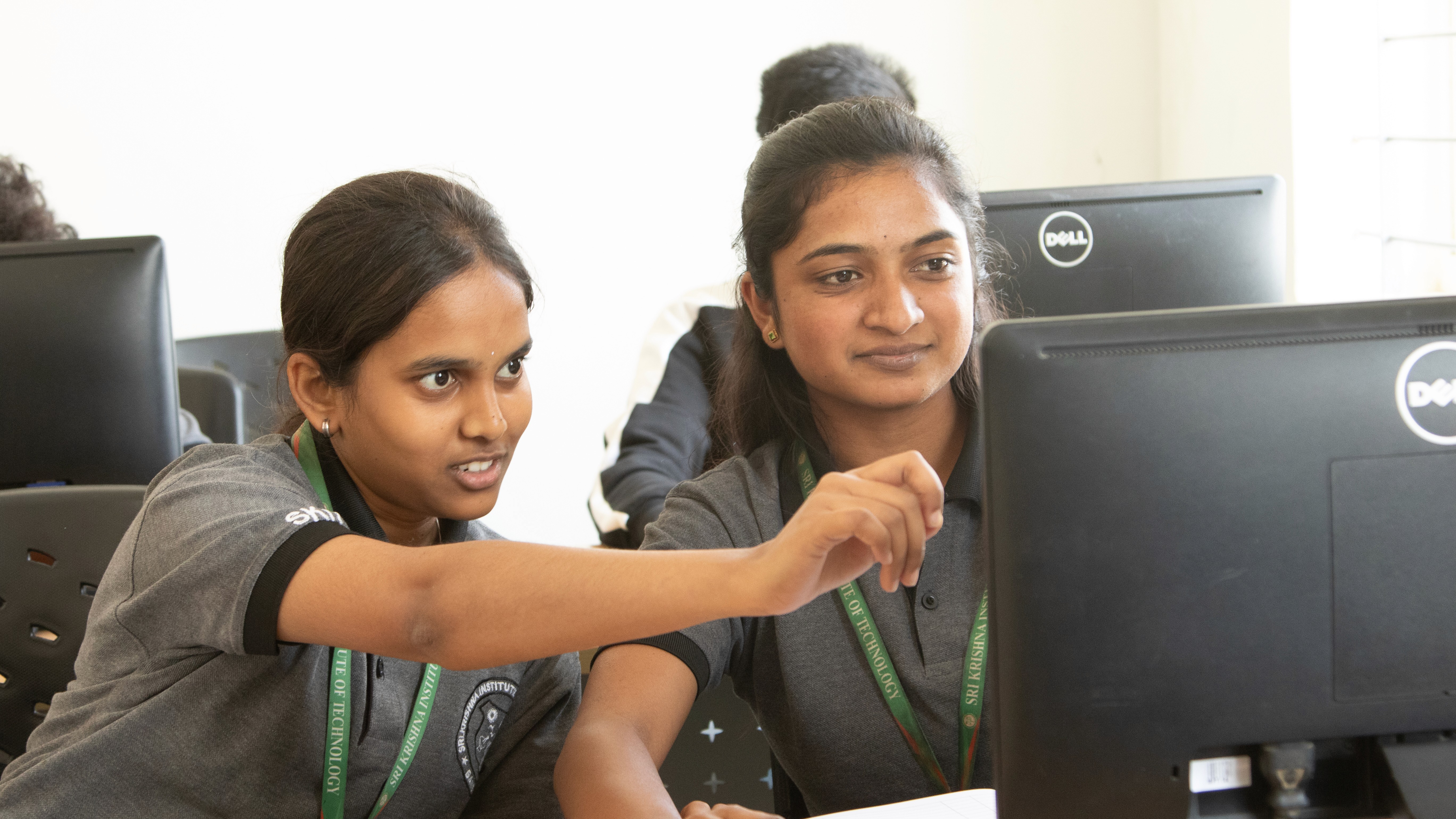 woman in black shirt holding green and blue plastic toy
