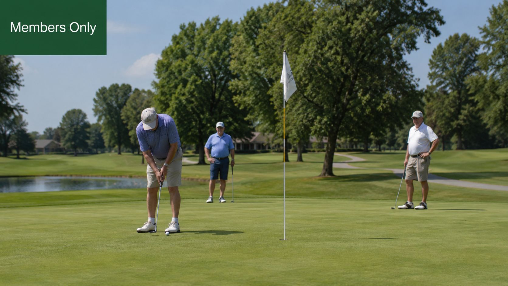 Three men golfing on a green at the Ponca City Country Club on a sunny day.