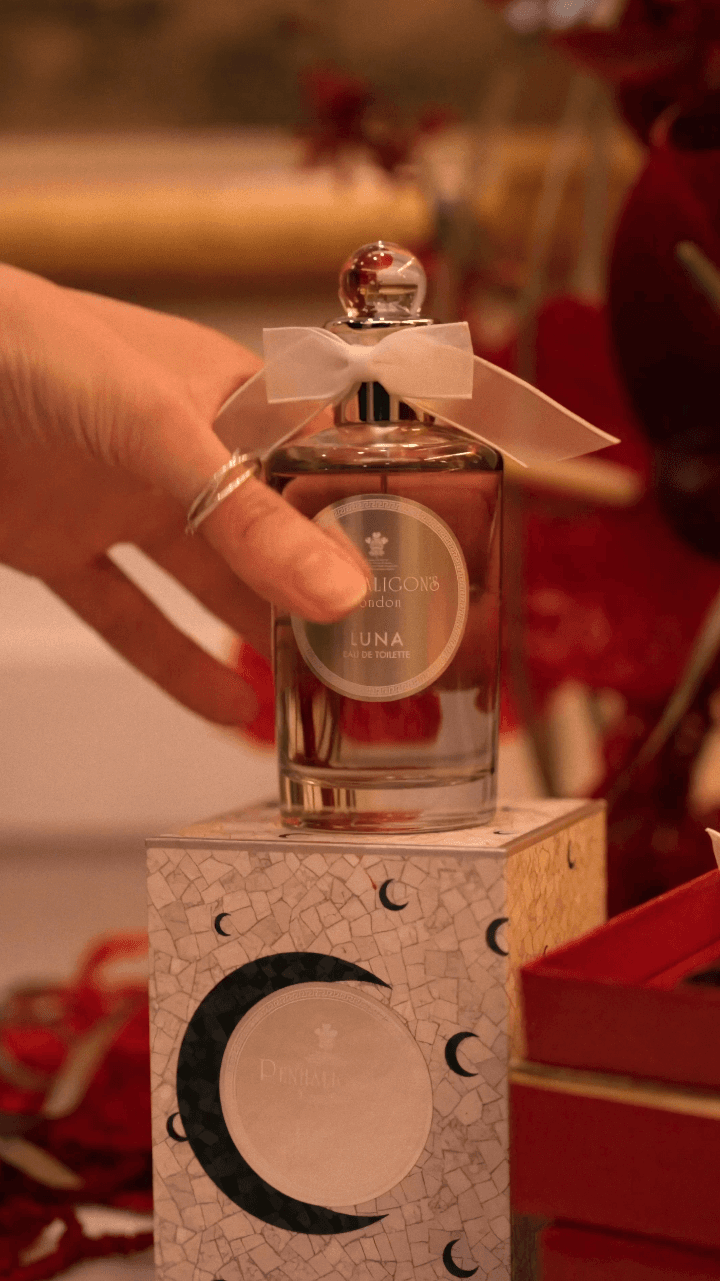 Bride in white dress walking on street, man in background