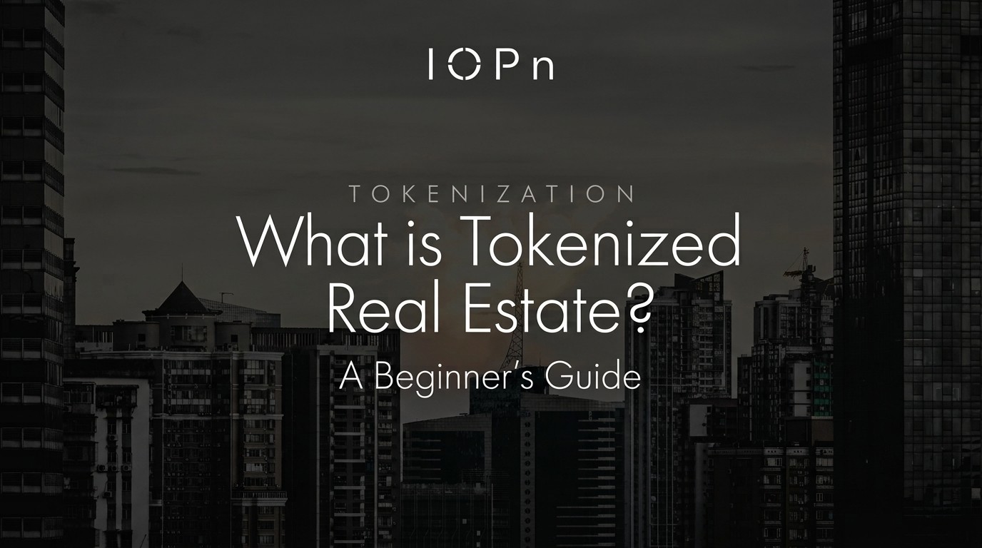 IOPn blog header for "What is Tokenized Real Estate? A Beginner's Guide," with a dark city skyline of high-rise towers at dusk.