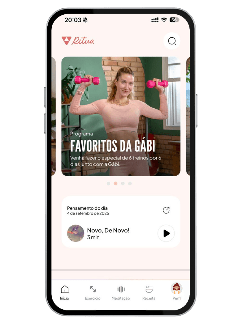 Smiling female therapist with short gray hair, wearing a brown top and a purple shawl, surrounded by a cozy background.