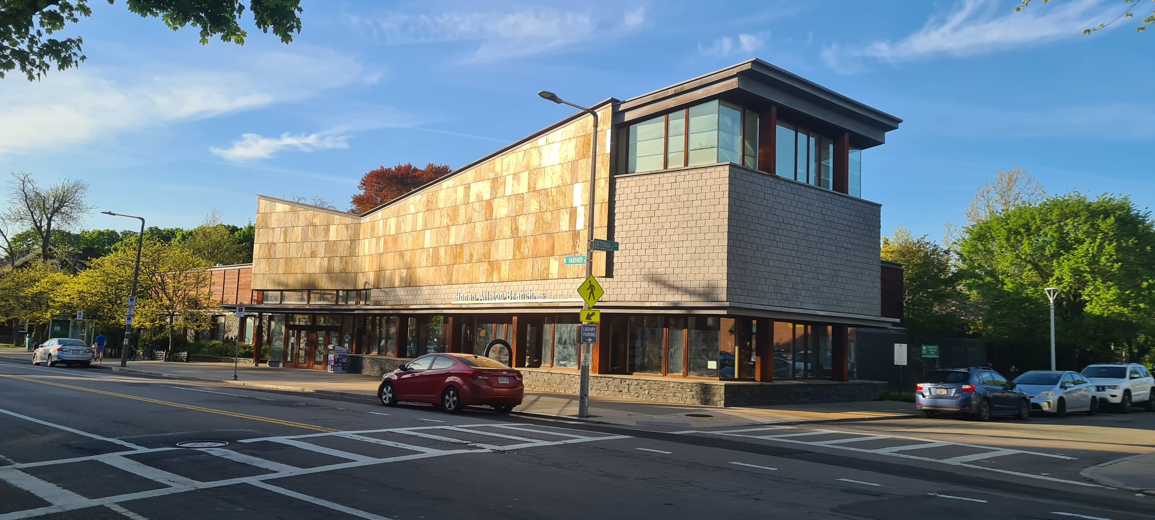 a group of people walking on a sidewalk
