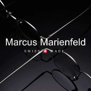 Airplane wing seen through a window above clouds