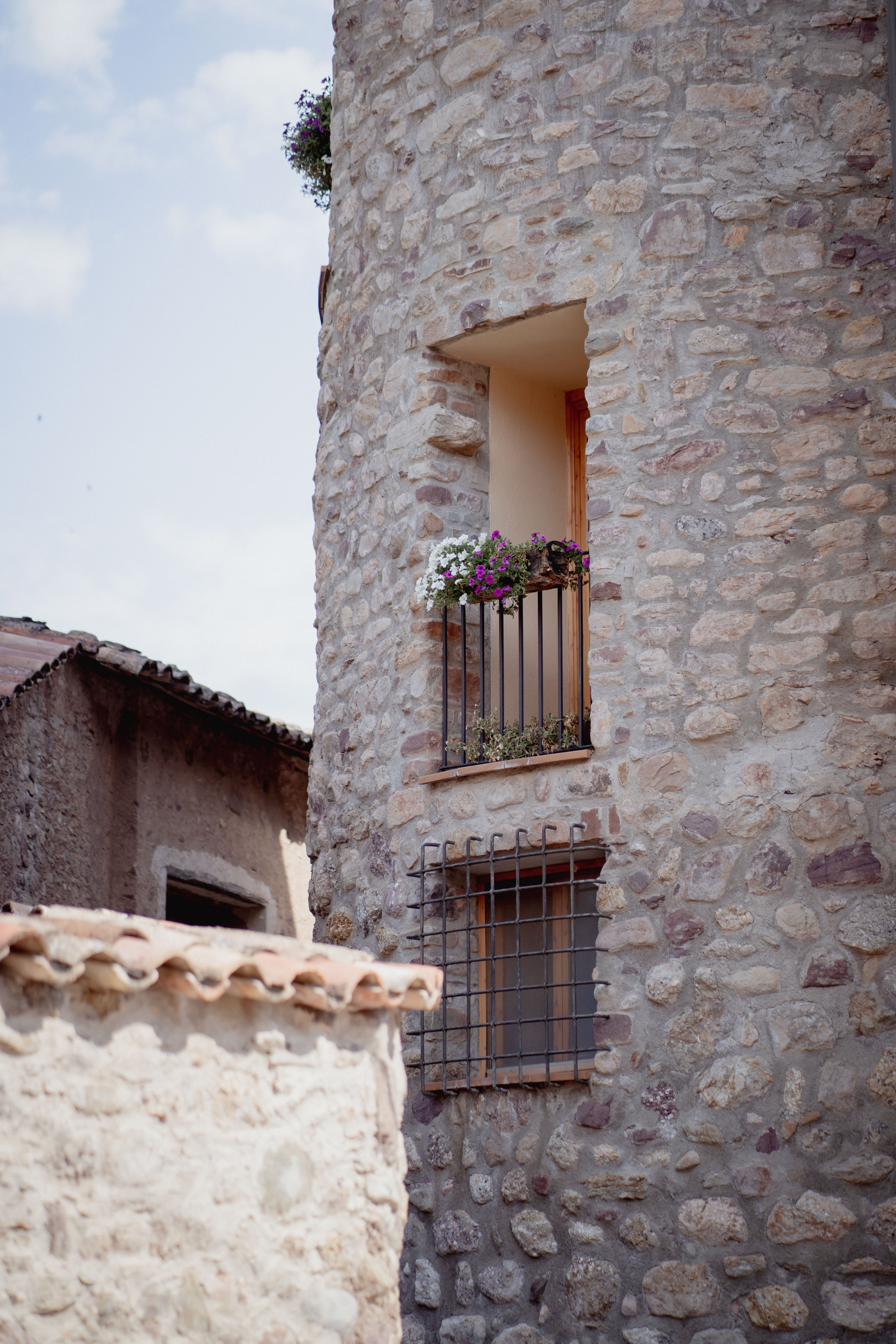 mountain valley with green grass and little village in the middle