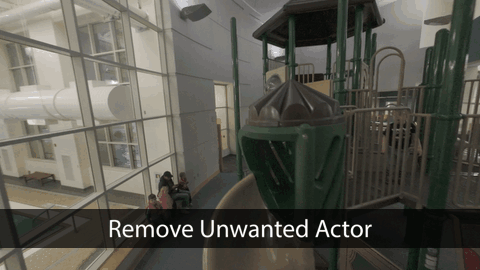 A serene outdoor seating area with two chairs, surrounded by lush greenery and a glassed-in structure.