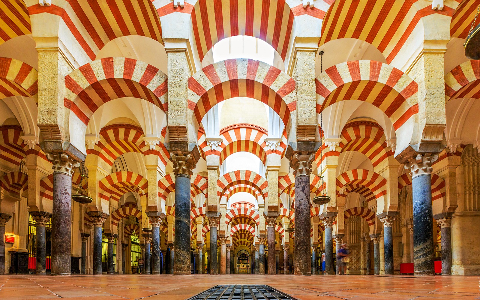 Cordoba Mosque-Cathedral prayer hall with red and white arches.