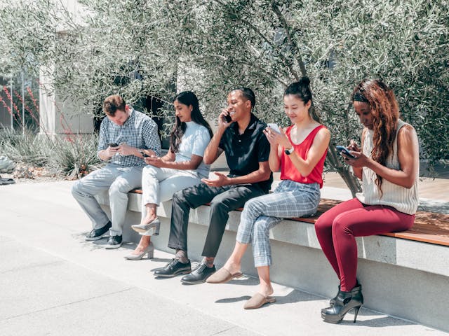 People using their phones different ways