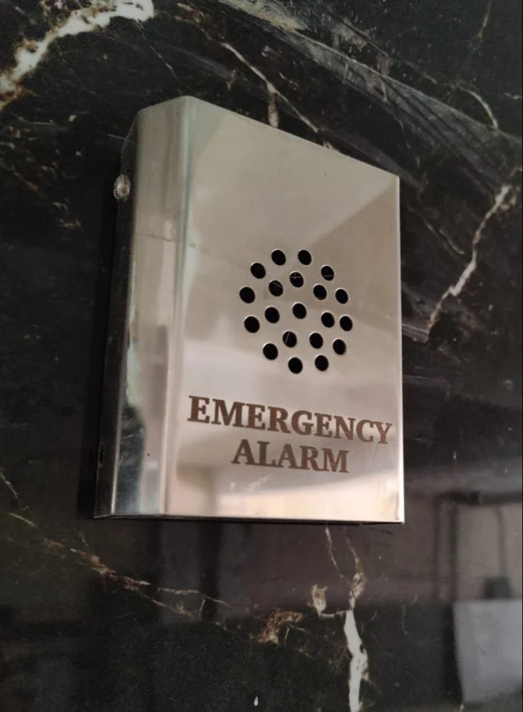 Installed emergency alarm with button