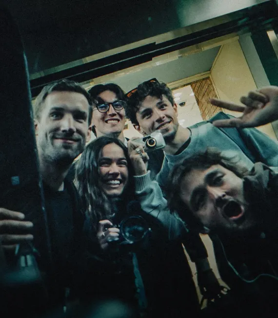 Reilin and Moos posing for a picture with their crew