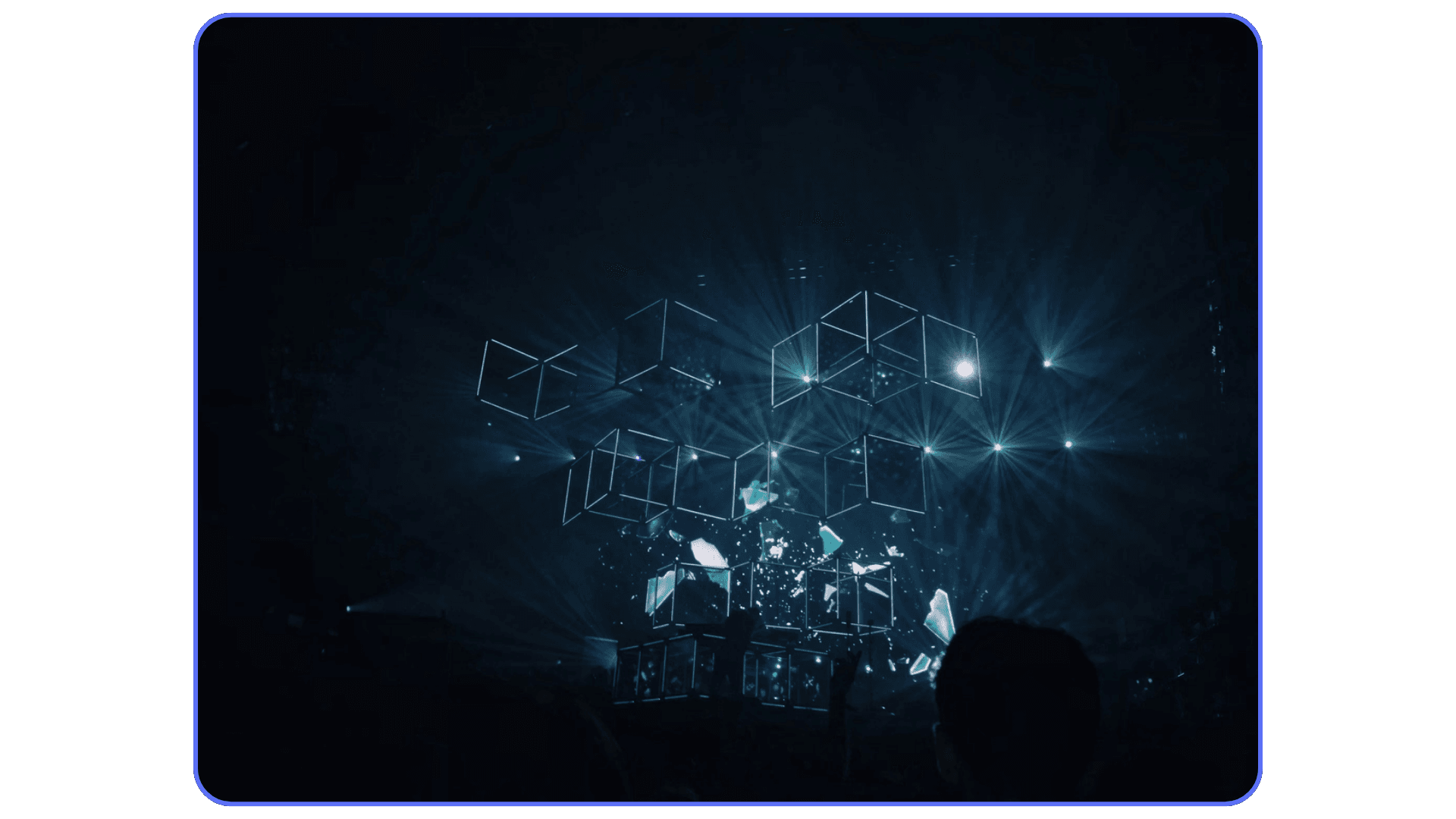 Abstract projection of floating cube structures with blue light and digital effects, evoking virtual reality or 3D visualization.