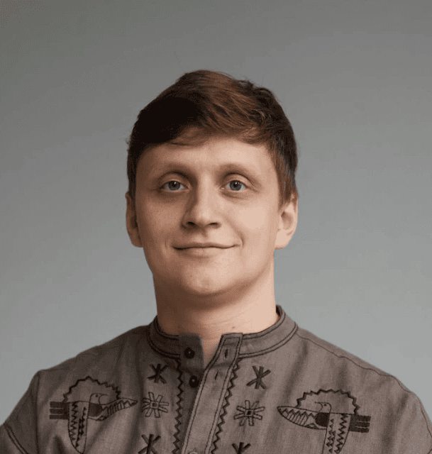 person wearing blue top smiling