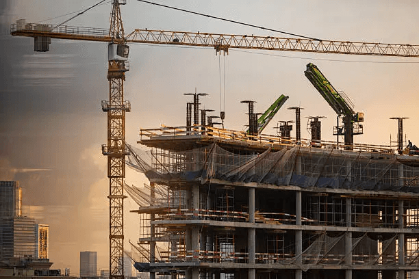 seven construction workers standing on white field