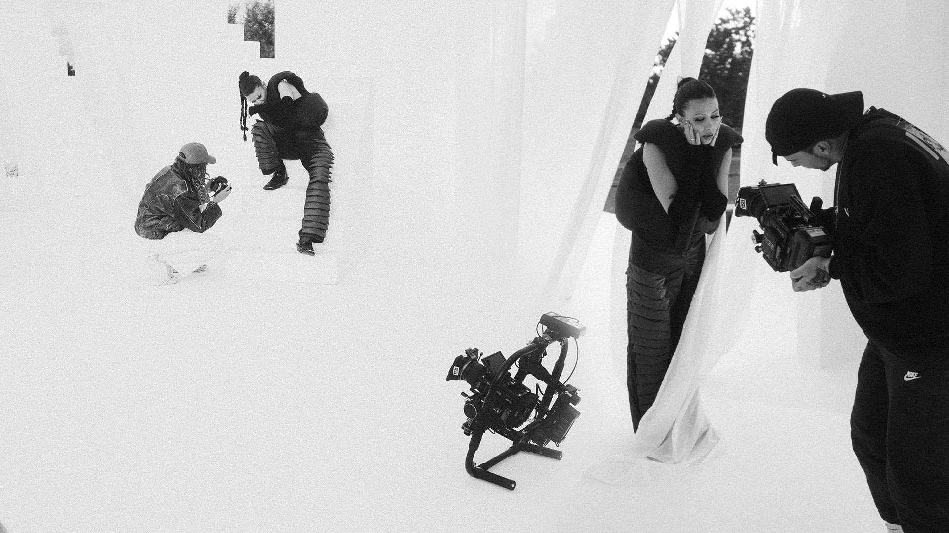 black and white image, people working on a movie set for a musicvideo lights and monitor in studio, shari sängerin, model in mallorca bei einem videodreh