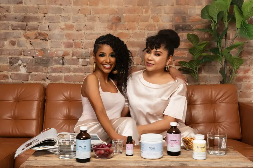 Coach Gessie, founder of DETOX NOW, with Angela Yee and DETOX NOW products