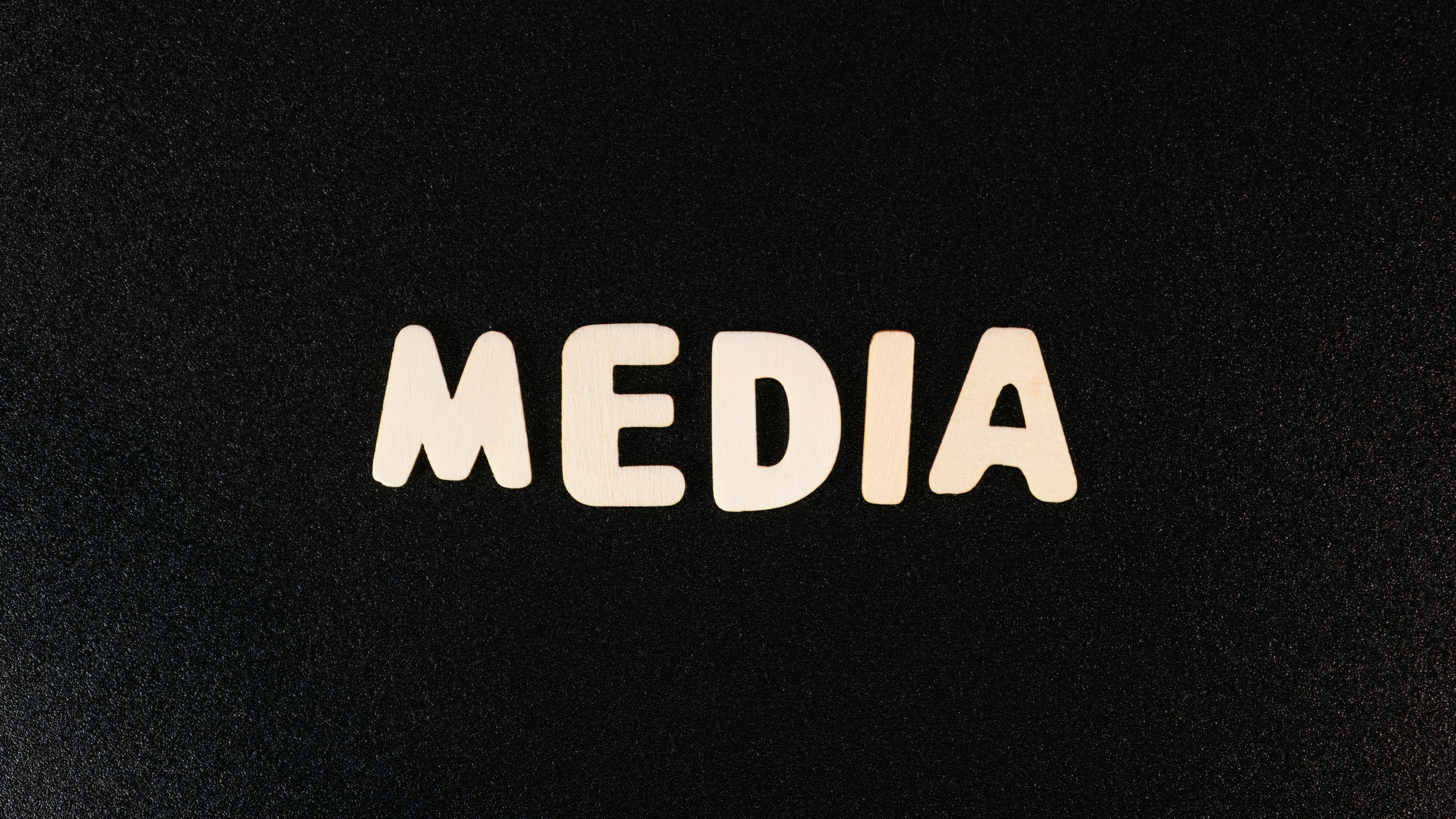 the word media spelled with white letters on a black background