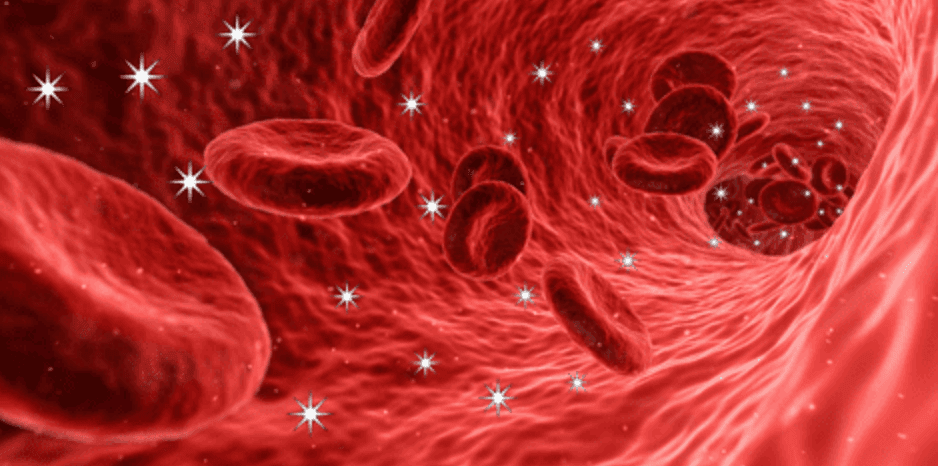 Red blood cells flowing through a blood vessel with excess sugar particles in the bloodstream.
