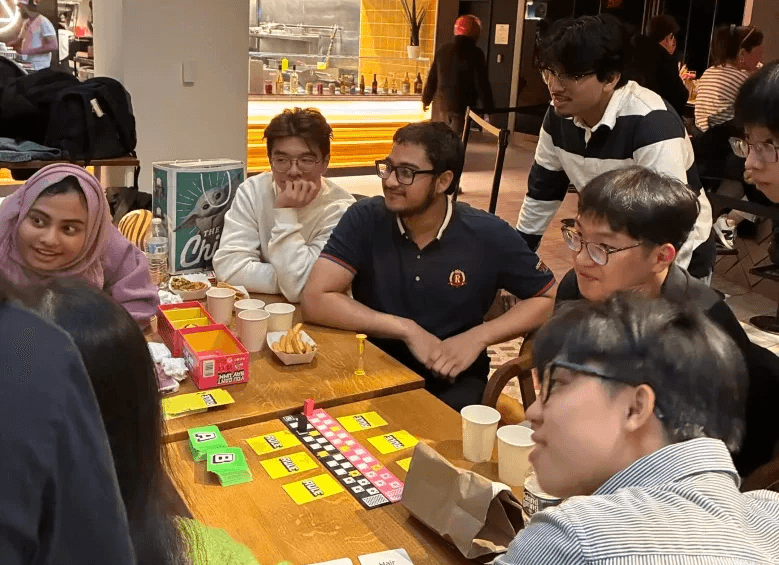 People gathering and playing board games