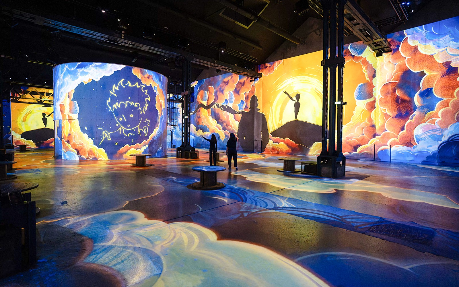 Visitors at the Little Prince exhibition, Atelier Des Lumières, Paris, France.