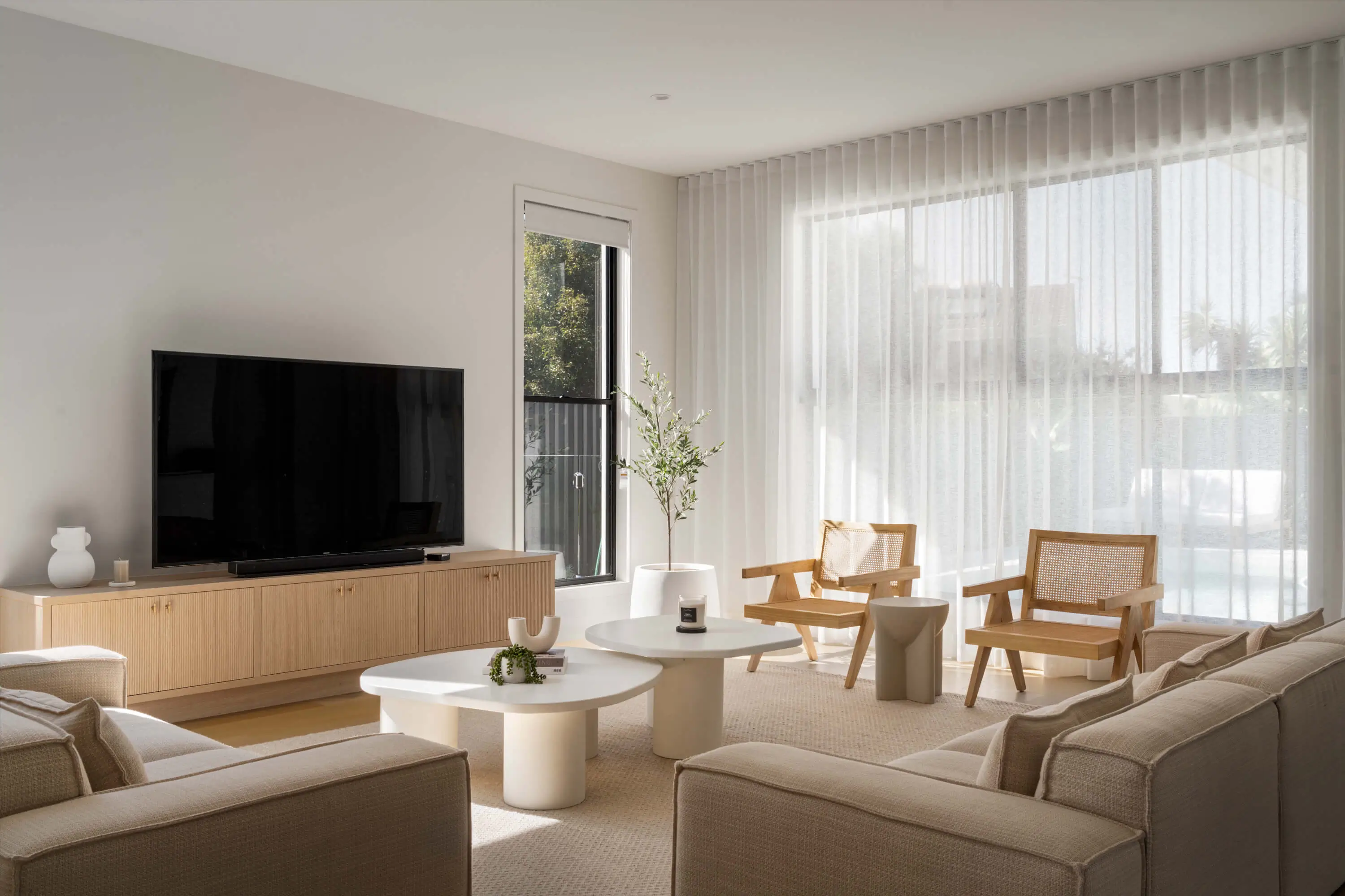 Light filled minimalist living room in a custom built home