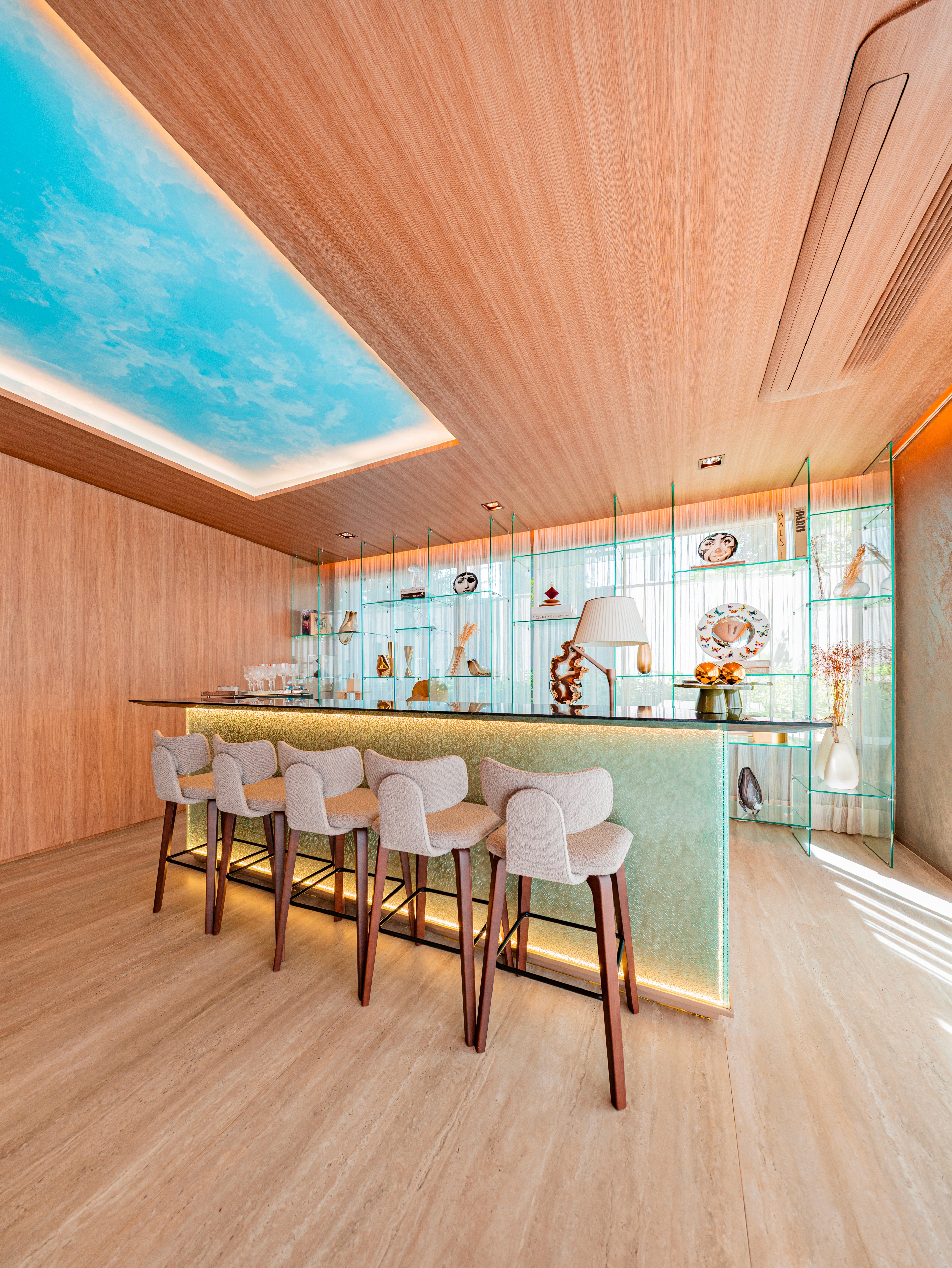 Curved modern skyscraper against a clear blue sky.