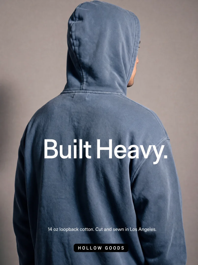 Hollow Goods apparel ad: Built Heavy. A close-up of a heavyweight blue hoodie.