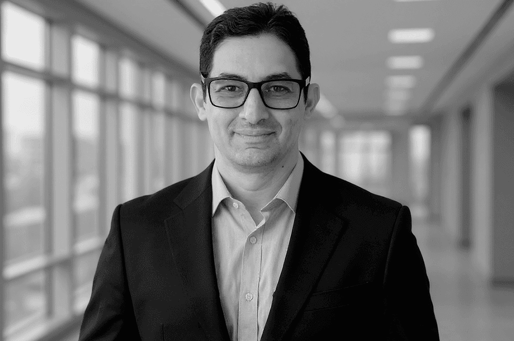 man filming on beach