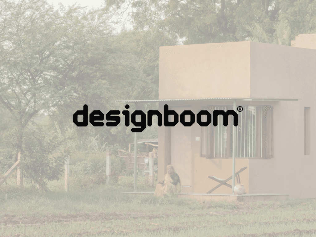 brown wooden house on green grass field near green mountains under white clouds during daytime