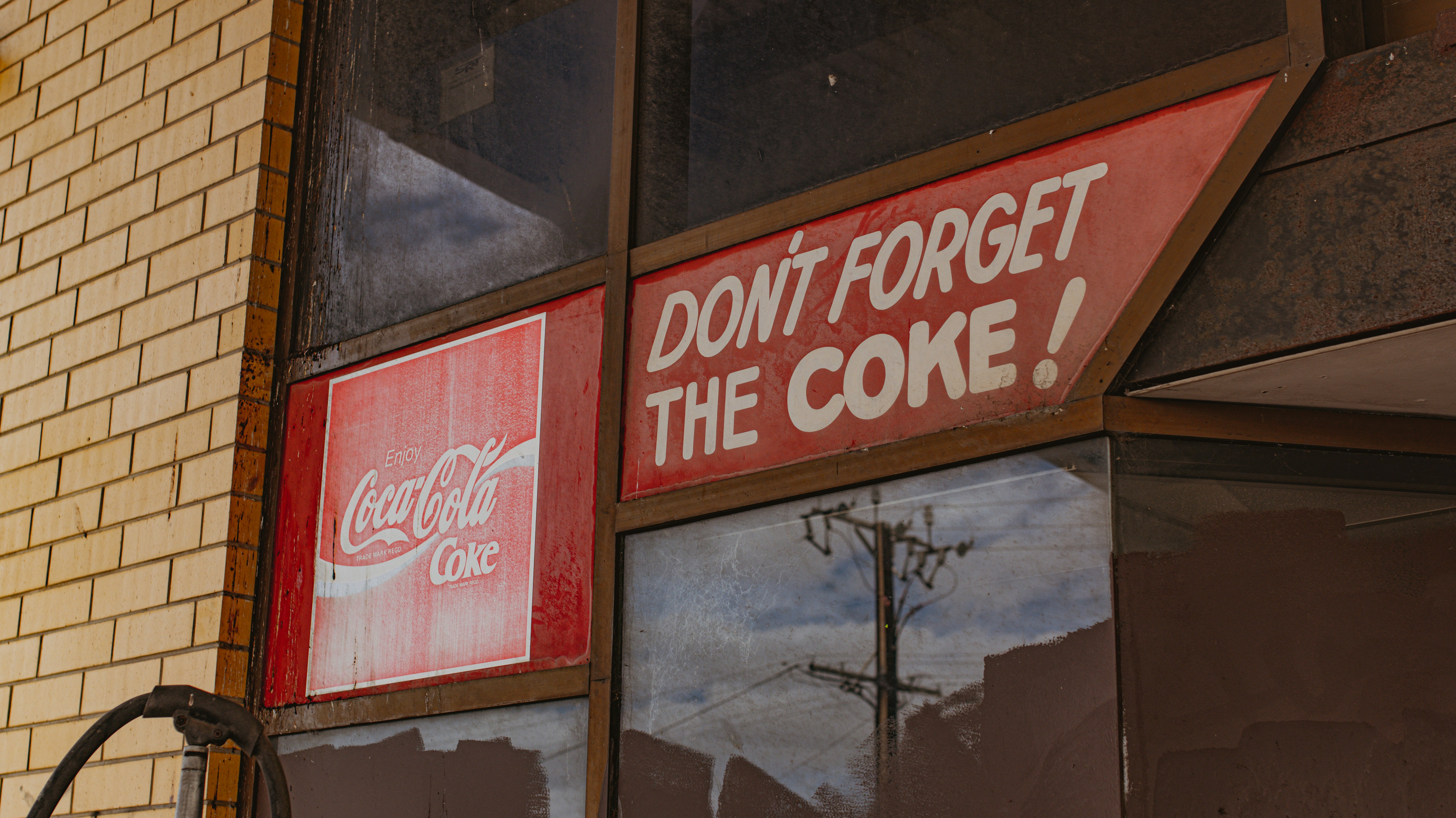 a don't forget the cone sign on the side of a building