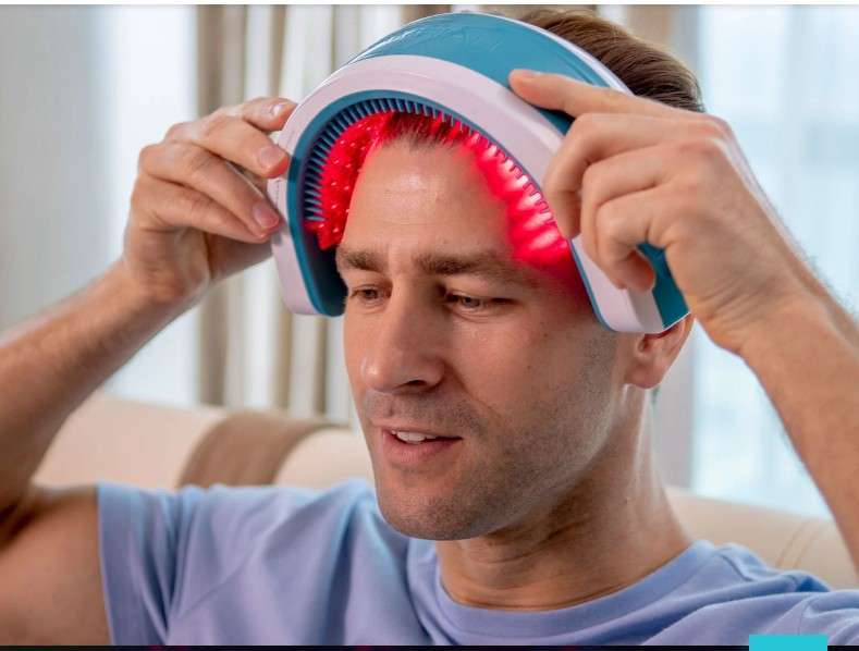 A man doing low level laser therapy sessions for hair regrowth